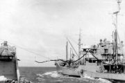 photograph showing ship receiving replenishment